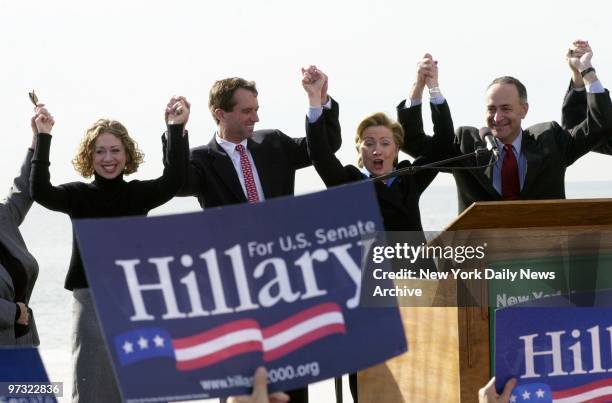 Democratic Senate hopeful Hillary Rodham Clinton is joined by daughter Chelsea, Robert F. Kennedy Jr. And Sen. Chuck Schumer during a rally on the...