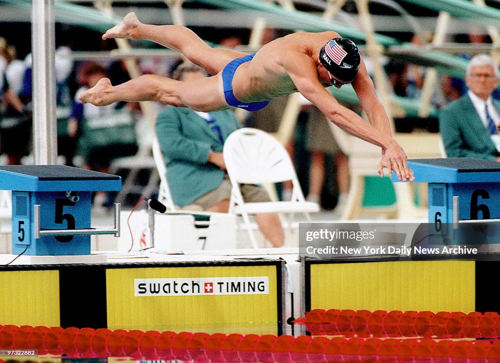 United States swimmer Gary Hall Jr. dives into the pool on h