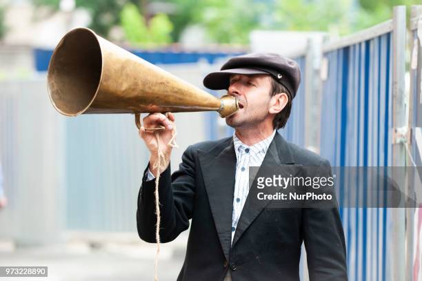 Man with an antique megaphone advertises the opening of the Polish Vodka Musuem on June 12, 2018 in Warsaw, Poland.