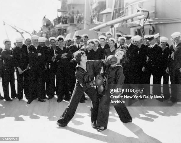 Universal Pictures stars Dorothy Gulliver and Barbara Kent entertaining the crew of the California.