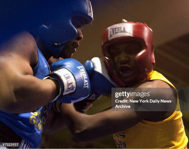 Kalib Walker and Dushane Crooks fight at a Golden Gloves 2009 season bout at Bishop Ford High School.