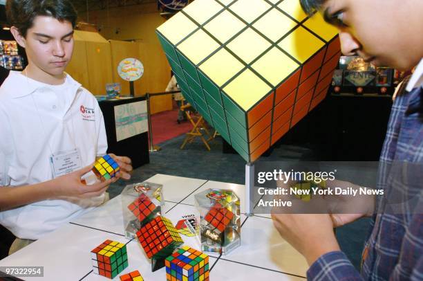 Kamran Jehle and Krishanu Roy Sankar "speed cubers" and winners of Horace Mann High School's Rubik's Cube competition, go head-to-head during the...