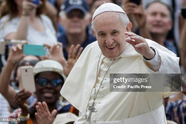 Pope Francis waived to the audience during the Weekly General Audience in St. Peter's Square.