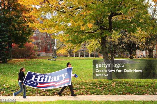 Students carry a large sign as they make their way to where Democratic presidential candidate Sen. Hillary Rodham Clinton is scheduled to speak at...