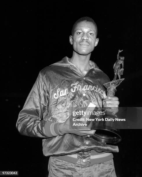 University of San Francisco basketball star Bill Russell with his MVP award from game against UCLA.