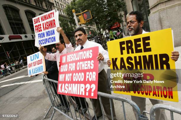 Demonstrators hold signs along Madison Ave., calling for the end of Indian occupation of Kashmir, during the Pakistan Independence Day Parade.