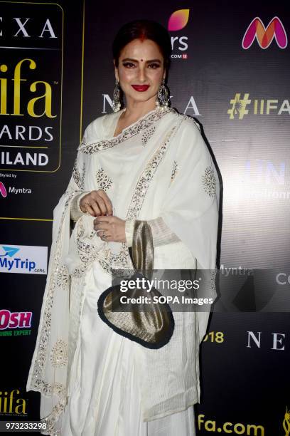 Indian film actress Rekha poses during a press conference in Mumbai for the 19th edition of Nexa IIFA Awards which happening in Thailand.