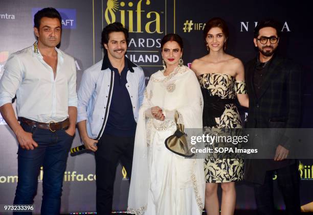 Indian film actors Bobby Deol, Varun Dhavan, Rekha, Kriti Sanon and Ayushmann Khurrana pose during a press conference in Mumbai for the 19th edition...