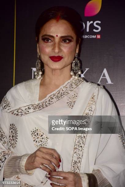 Indian film actress Rekha poses during a press conference in Mumbai for the 19th edition of Nexa IIFA Awards which happening in Thailand.