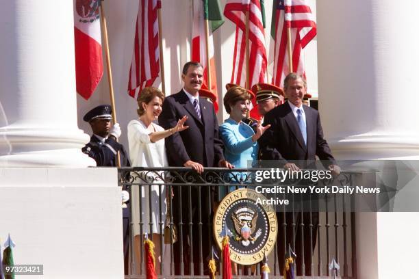 Mexican President Vicente Fox and wife Martha Sahagun join President Bush and wife Laura on the White House balcony at ceremonies welcoming Fox to...