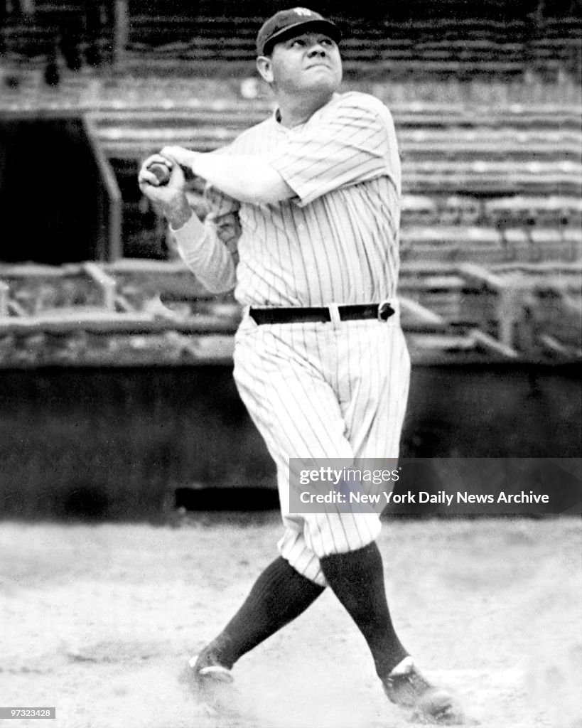 New York Yankees' Babe Ruth swinging his bat. Babe Ruth fol