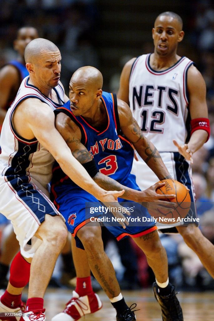 New York Knicks' Stephon Marbury tries to drive past New Jer