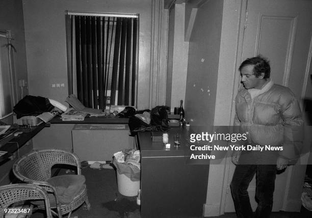Studio 54 co-owner Steve Rubell looks over mess in office after federal agents raided the disco.