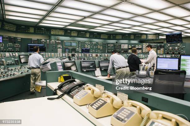 Reactor operators work in the control room at the Exelon Corp. Three Mile Island nuclear power plant in Middletown, Pennsylvania, U.S., on Wednesday,...