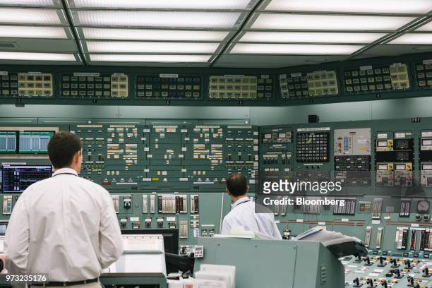 Reactor operators work in the control room at the Exelon Corp. Three Mile Island nuclear power plant in Middletown, Pennsylvania, U.S., on Wednesday,...
