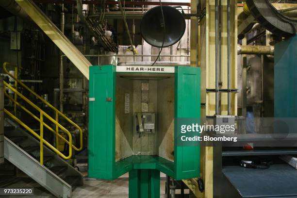 Phone booth stands in the lower level turbine room at the Exelon Corp. Three Mile Island nuclear power plant in Middletown, Pennsylvania, U.S., on...