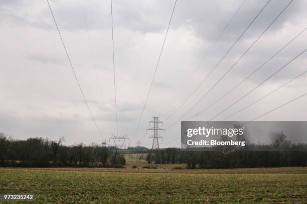 High-tension power lines stand on a farm near the Exelon Corp. Three Mile Island nuclear power plant in the neighborhood of Londonderry Township near...