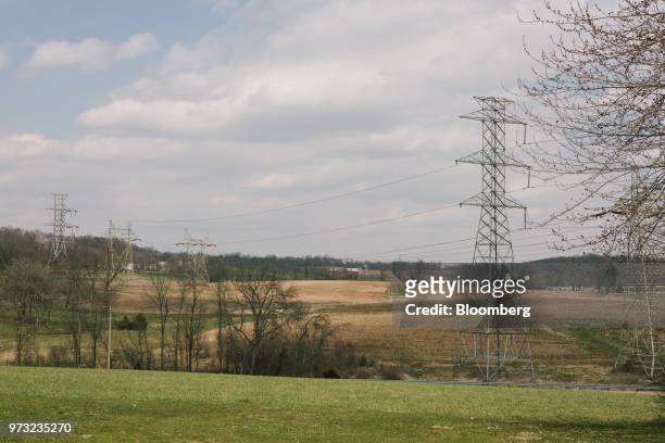 High-tension power lines stand on a farm near the Exelon Corp. Three Mile Island nuclear power plant in the neighborhood of Londonderry Township near...