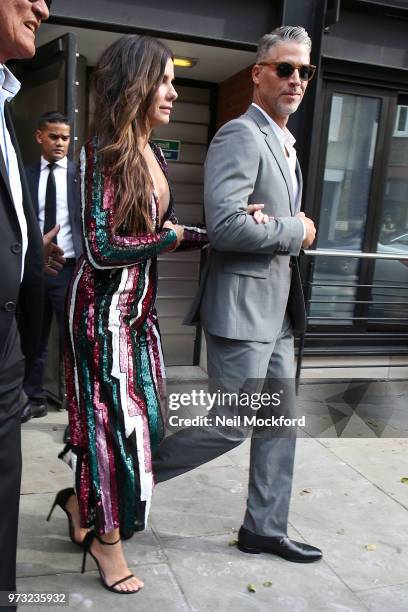 Sandra Bullock and Bryan Randall leaving their hotel ahead of the 'Ocean's 8' film premiere on June 13, 2018 in London, England.