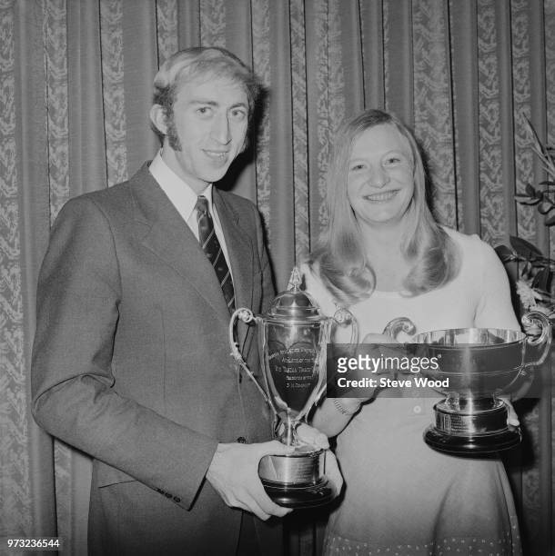British track and field athletes David Hemery and Mary Peters with trophies awarded by the British Athletics Writers Association, UK, 29th October...