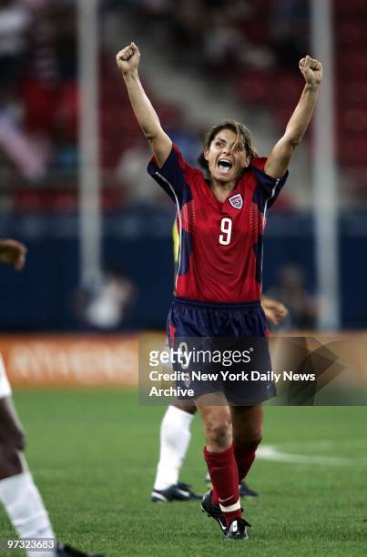 Mia Hamm of the United States celebrates after she and her team - the Fab Five - beat Brazil 2-1 in overtime for Olympic gold in women's soccer at...