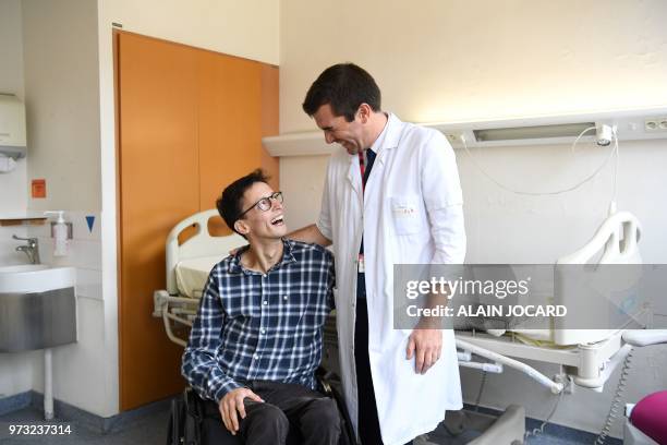 Guillaume Canaud , doctor and researcher at the French National Institute for Health and Medical Research , poses with Emmanuel, a patient who has...
