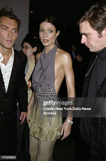 Gwyneth Paltrow is flanked by Jude Law and Jack Davenport at the premiere of the movie "The Talented Mr. Ripley" at the Museum of Modern Art. They're...
