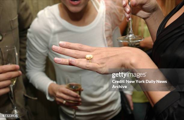 Newly engaged supermodel Heidi Klum shows off her new sparkler, given to her by singer Seal, at a party celebrating the show at Le Parker Meridien...