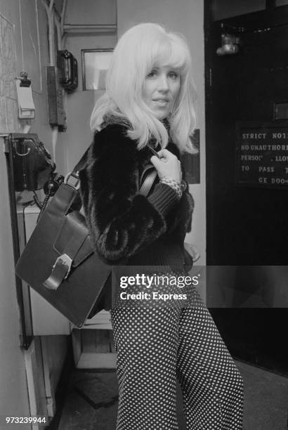 British fashion model and actress Fiona Richmond pictured in a courthouse to testify in Paul Raymond's divorce case, UK, 25th November 1972.