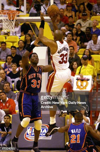 Miami Heat's Alonzo Mourning shoots over New York Knicks' Patrick Ewing in Game 1 of the NBA Eastern Conference playoffs in Miami. The Heat won,...