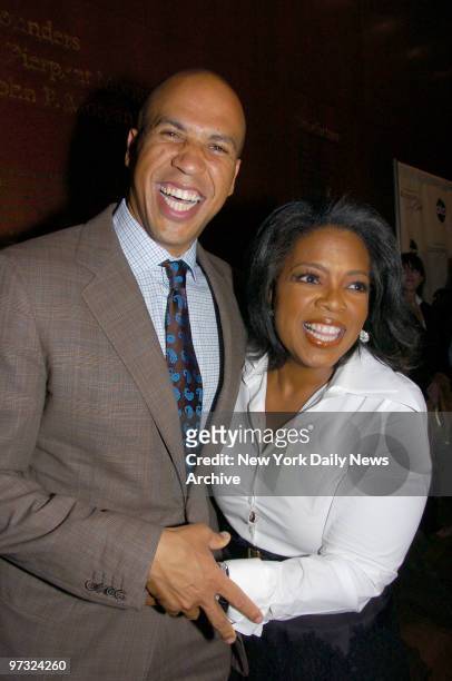 Newly-elected Newark Mayor Cory Booker and Oprah Winfrey arrive at the Morgan Library & Museum for a screening of her upcoming TV special "Oprah...
