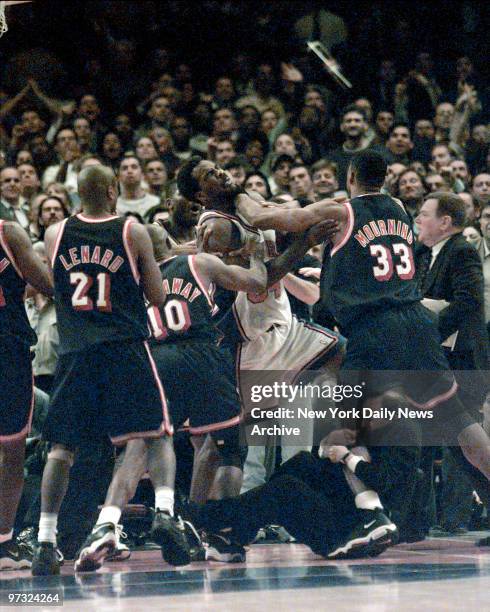 New York Knicks vs. Miami Heat at MSG for Game4... Knicks Charles Oakley is shoved by Heats Alonzo Mourning while Jeff Van Gundy got a piece of...