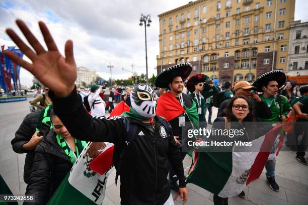 Mexican fans celebrate after winning the offer of the 2026 FIFA World Cup in conjunction with the United States and Canada, at Moscow downtown on...