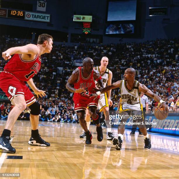 Travis Best of the Indiana Pacers looks to make a move against Michael Jordan of the Chicago Bulls in Game Six of the Eastern Conference Finals...