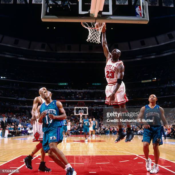 Michael Jordan of the Chicago Bulls dunks against the Indiana Pacers during a game played on May 3, 1998 at the United Center in Chicago, Illinois....