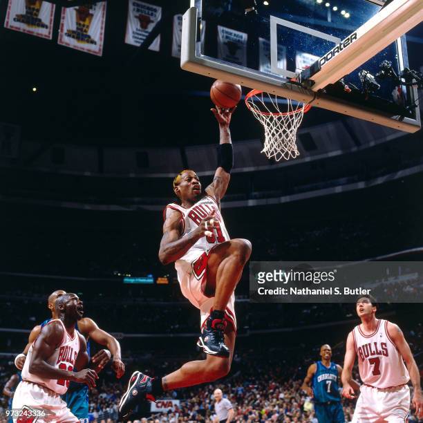 Dennis Rodman of the Chicago Bulls dunks against the Indiana Pacers during a game played on May 3, 1998 at the United Center in Chicago, Illinois....