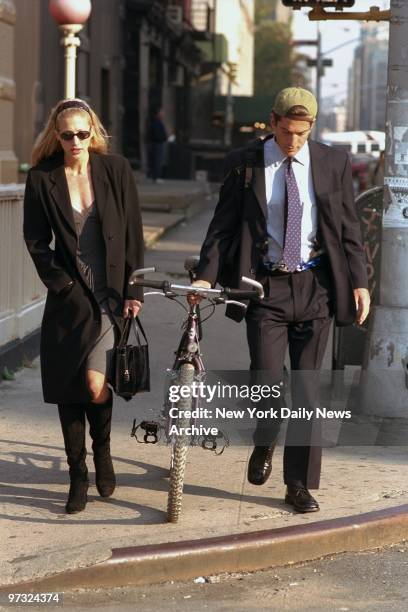 Newlyweds John F Kennedy Jr. And Carolyn Bessette Kennedy walk along Varick St.