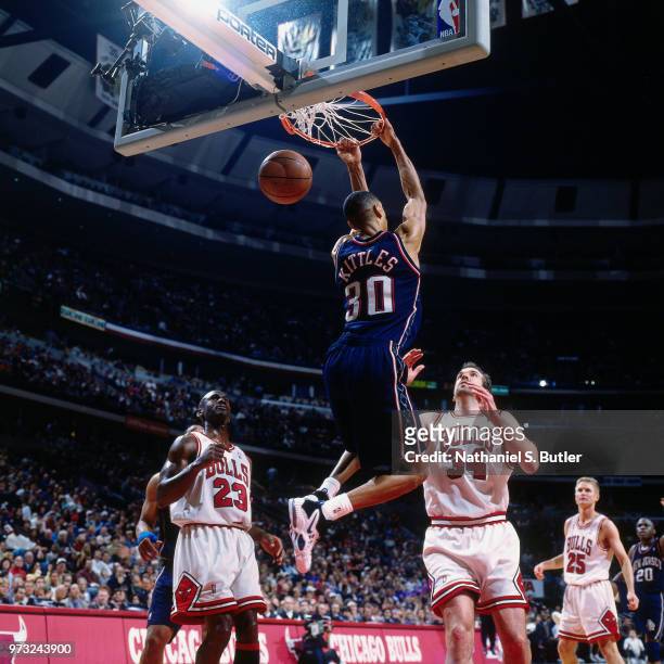 Kerry Kittles of the New Jersey Nets dunks against the Chicago Bulls during a game played on April 26, 1998 at the United Center in Chicago,...