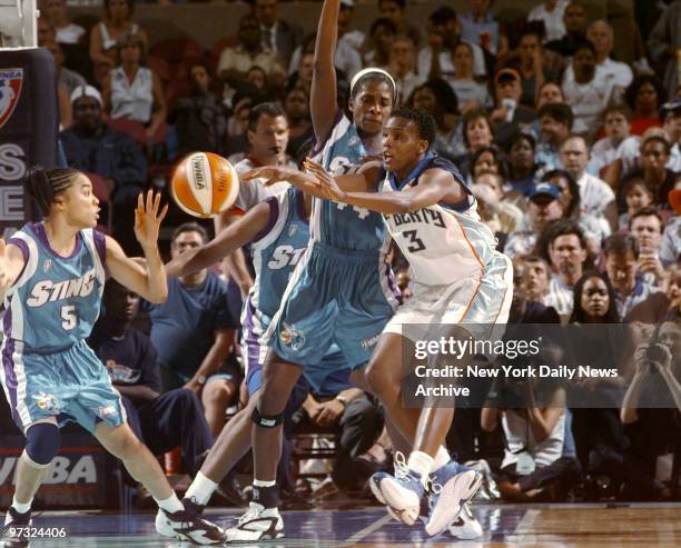 New York Liberty forward Crystal Robinson tries to pass the ball around traffic during first half of WNBA basketball action against the Charlotte...