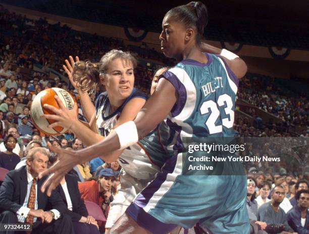 New York Liberty guard Becky Hammon tries to pass as Vicky Bullett defends during first half WNBA playoff game between the Liberty and the Charlotte...