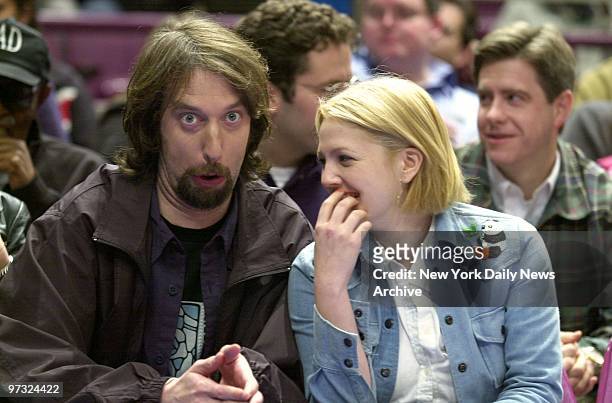 Newlyweds Tom Green and Drew Barrymore share a laugh while attending a game between the New York Knicks and Atlanta Hawks at Madison Square Garden.