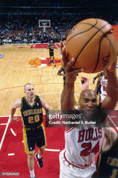 Scott Burrell of the Chicago Bulls dunks during a game played on May 27, 1998 at the United Center in Chicago, Illinois. NOTE TO USER: User expressly...