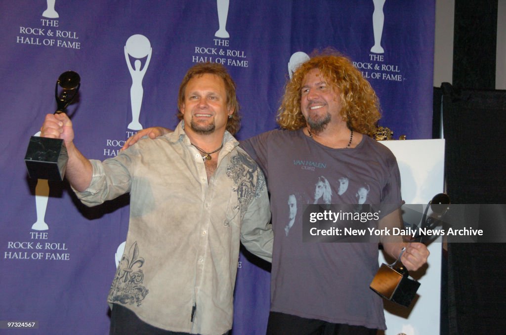 Michael Anthony (left) and Sammy Hagar of Van Halen clutch t