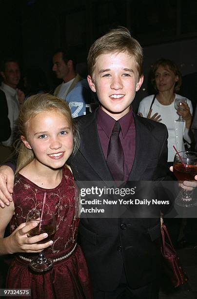 Haley Joel Osment and younger sister Emily are arm-in-arm at the Ziegfeld Theater for the New York premiere of the movie "A.I. Artificial...