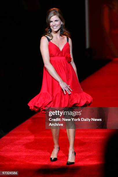 Newsperson Natalie Morales walks the runway at The Tent at Bryant Park as she participates in the Heart Truth Red Dress Collection show during New...