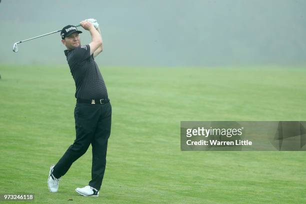 Branden Grace of South Africa plays a shot during a practice round prior to the 2018 U.S. Open at Shinnecock Hills Golf Club on June 13, 2018 in...