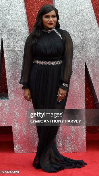 Actor Mindy Kaling poses on the carpet upon arrival to attend he European premiere of the film " Ocean's 8" in London on June 13, 2018.