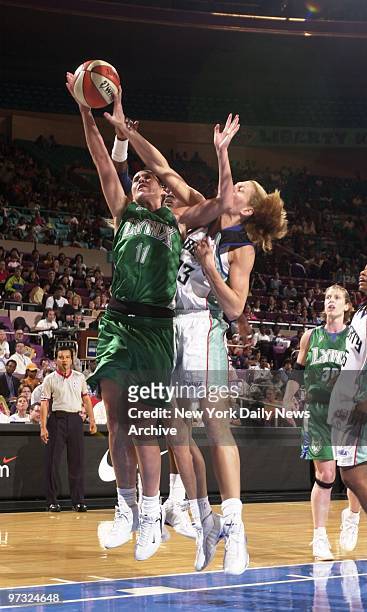 New York Liberty's Sue Wicks battles the Minnesota Lynx' Erin Buescher for the ball during first quarter of game at Madison Square Garden. The...