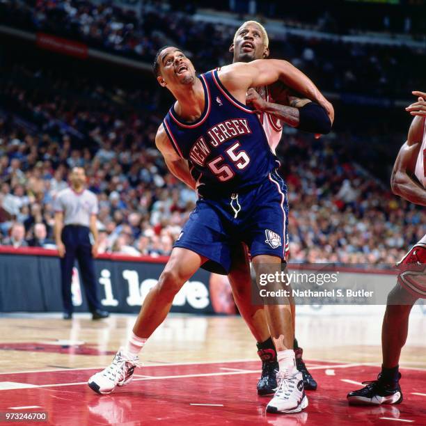 Jayson Williams of the New Jersey Nets defends Dennis Rodman of the Chicago Bulls during a game played on April 26, 1998 at the United Center in...