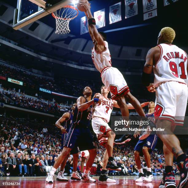 Scottie Pippen of the Chicago Bulls dunks against the New Jersey Nets during a game played on April 26, 1998 at the United Center in Chicago,...
